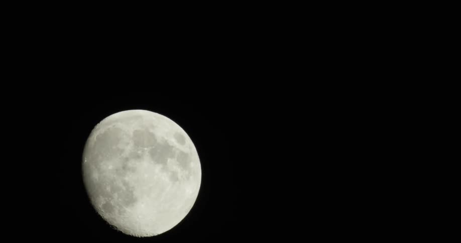 A moon rises in the evening