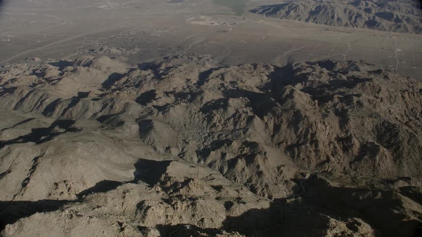 The hills are jagged and brown in color