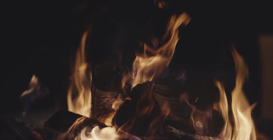 A fire is crackling at night