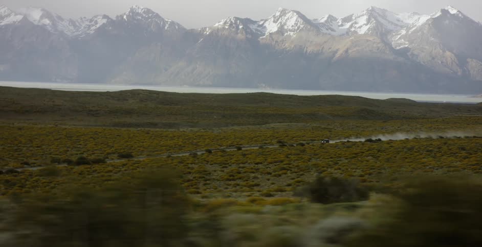 Snow capped mountains and flat plains