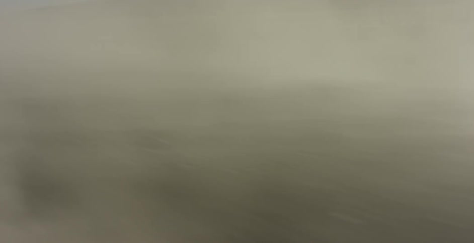 Dust flies behind as the dirt road