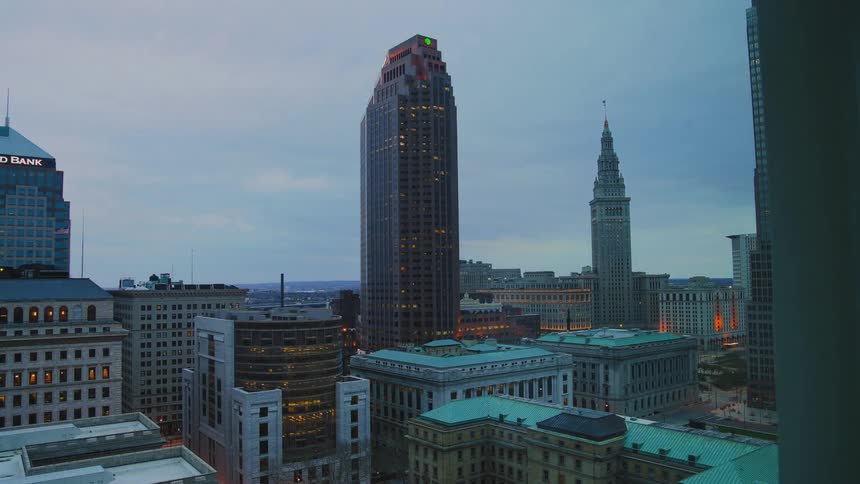 Clouds floating over city buildings