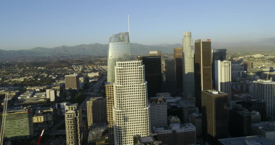 A view of a city with mountains in the background