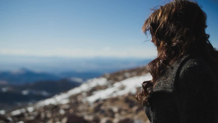 A woman is watching the sky
