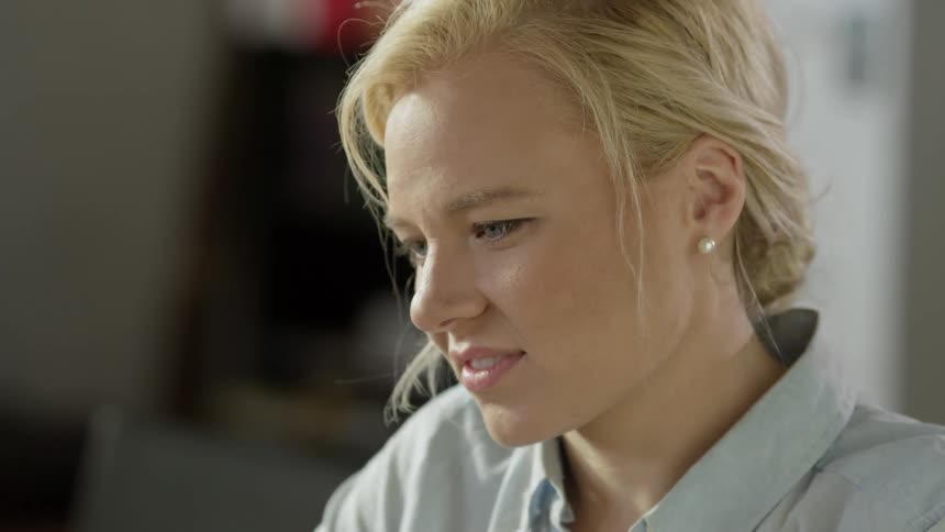 Woman smiling as she looks down