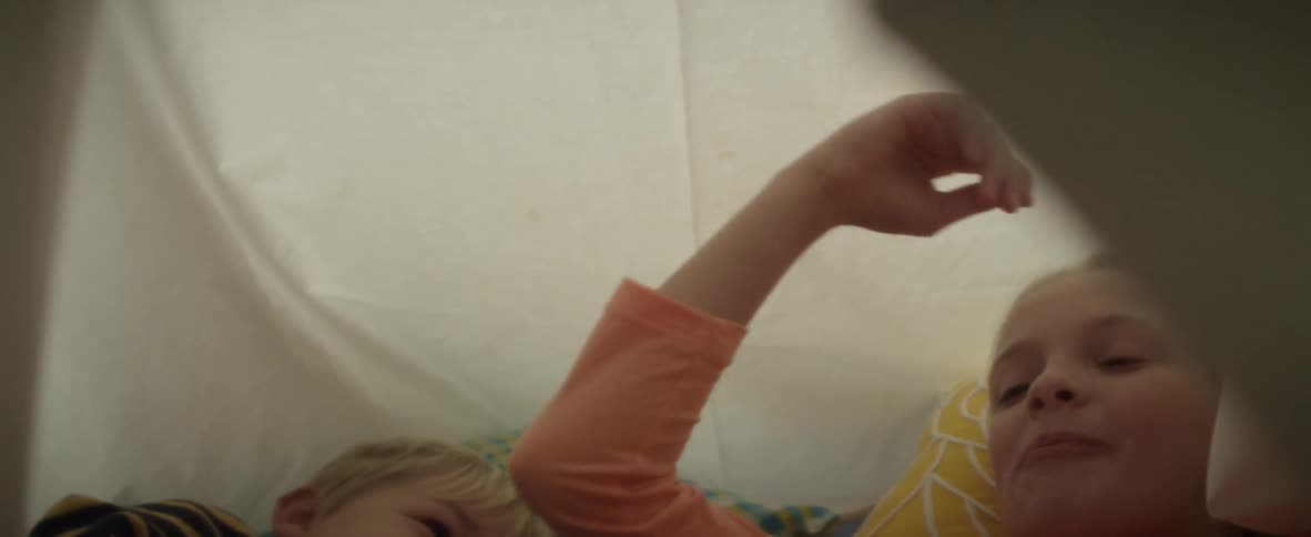 Children are playing in a tent