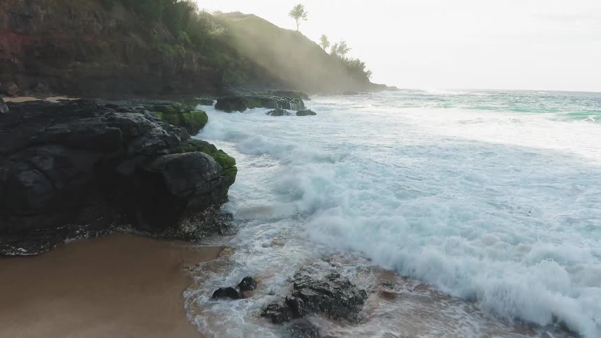 Ocean waves crash into a beach