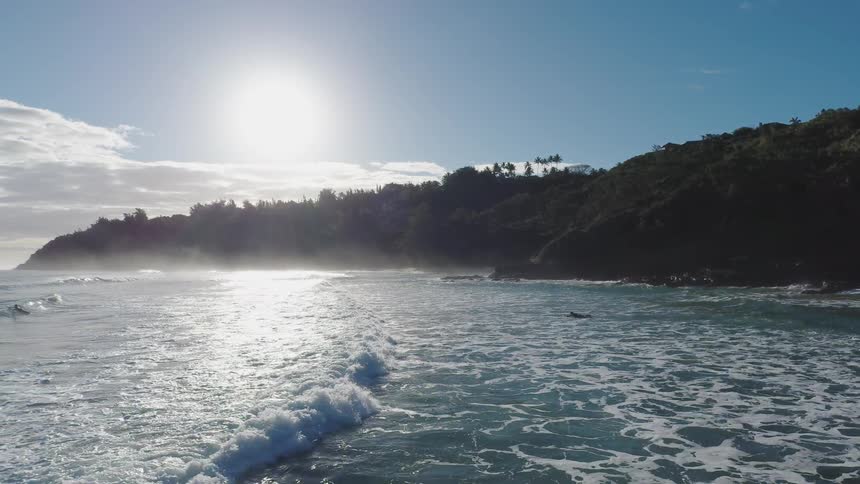 Waves flow onto the beach shore