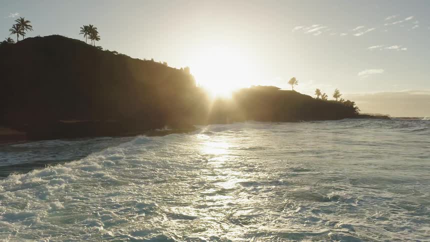 The sun sets over a beach