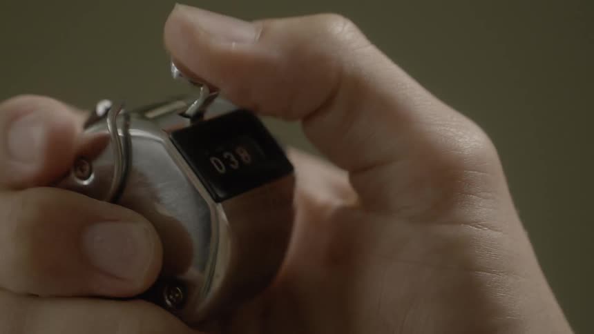 A person clicks a counter faster and faster