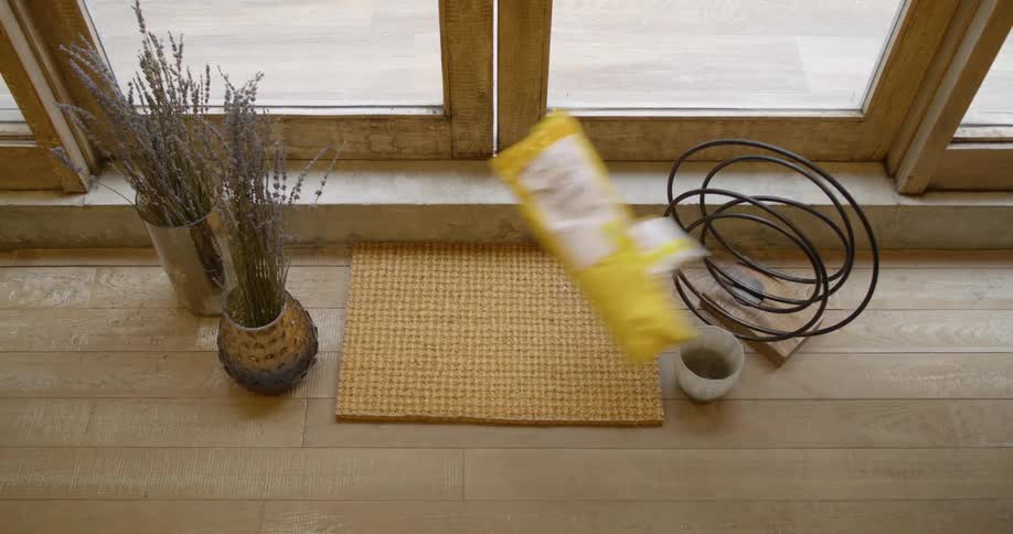 Two packages thrown on a table near plants