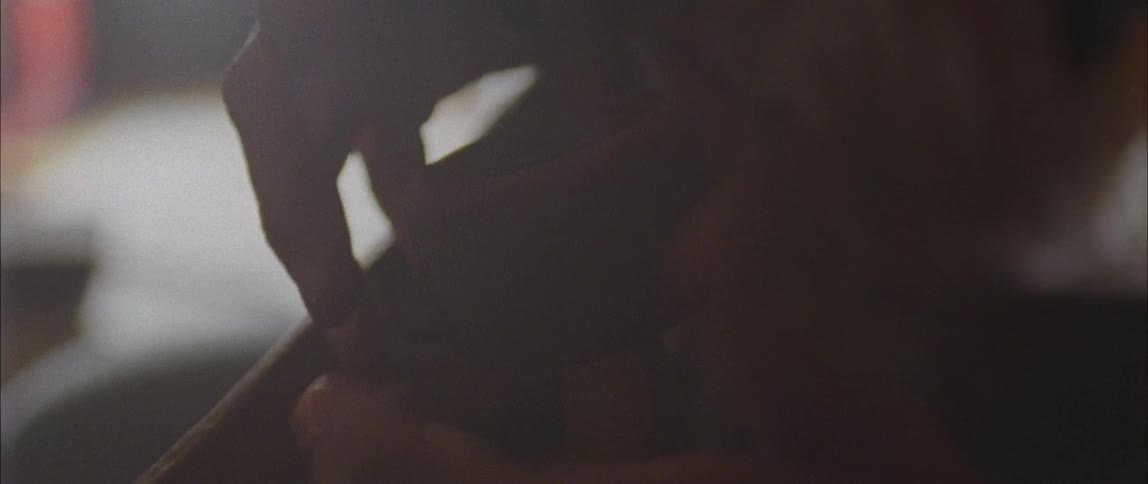 A man adjusts a skateboard wheel