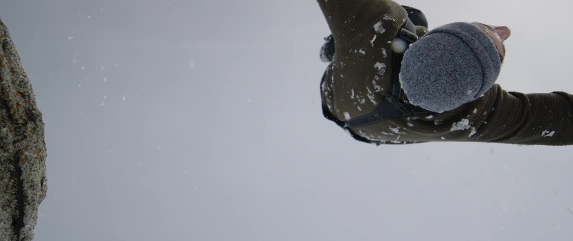 A man does a flip off the perch