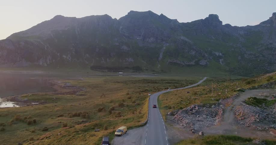The car passes a rest stop on the side of the road