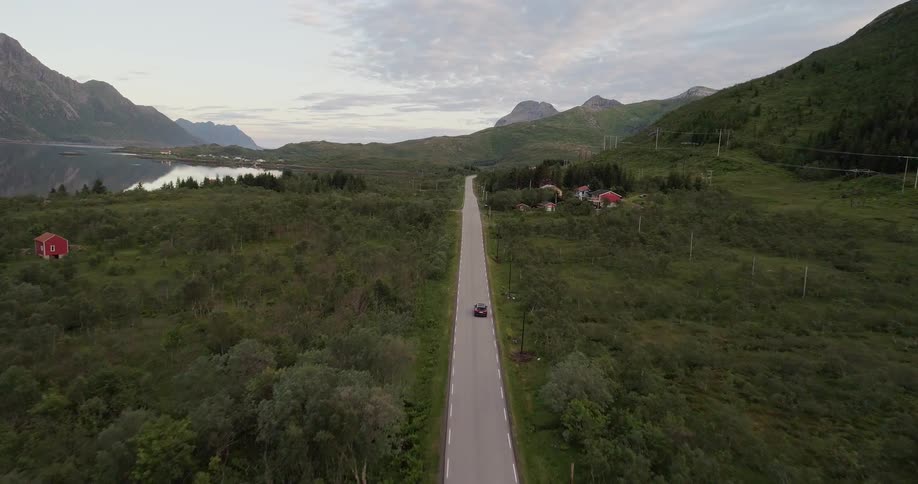 A car drives on a rural road