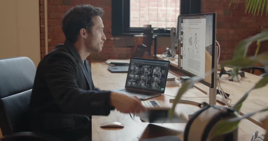 A man works at an office desk