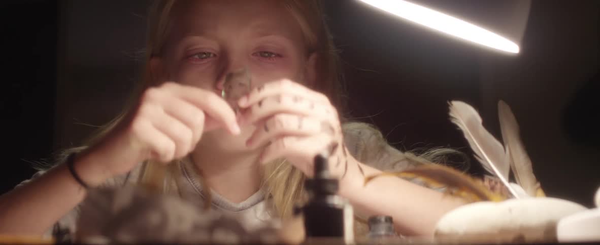 A child is making a toy