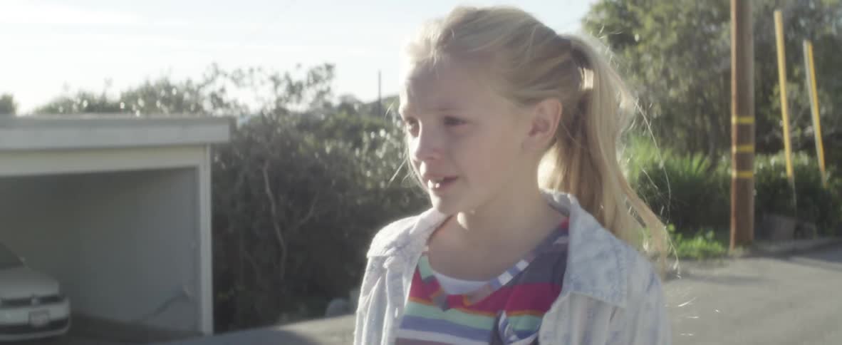 A child is walking down the street
