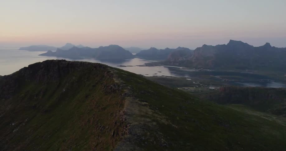 The sun sets over a mountain lake
