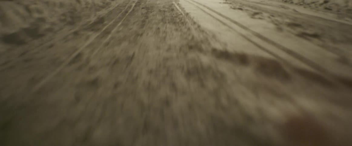 The road is wet, and full of ice