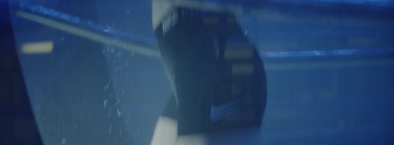 A woman running on a treadmill in a tank of water