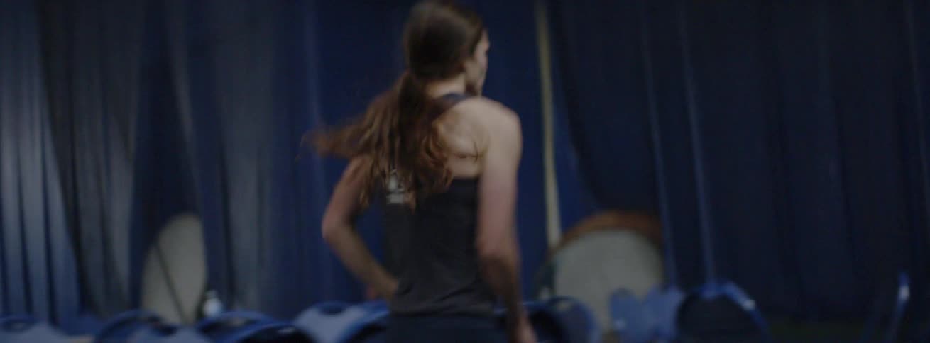 A track coach coaches a girls track team