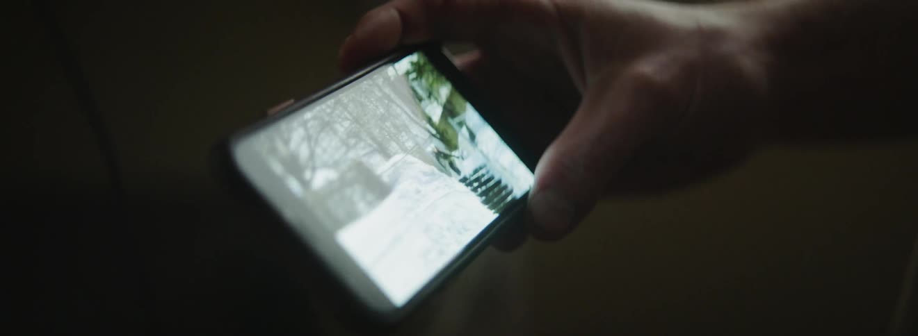 A person is watching a video on their phone