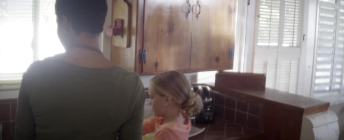 A child is drying dishes