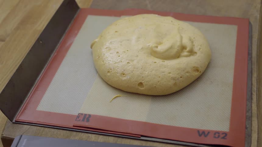 Batter is poured onto a mat