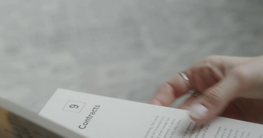 A person flips through a book