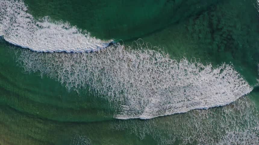 Waves roll towards shore