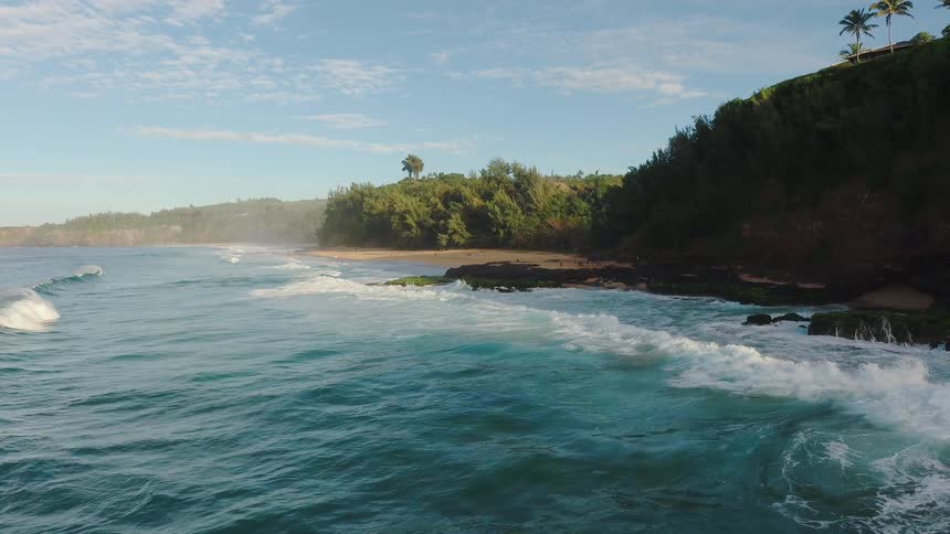 Ocean waves crash into a beach