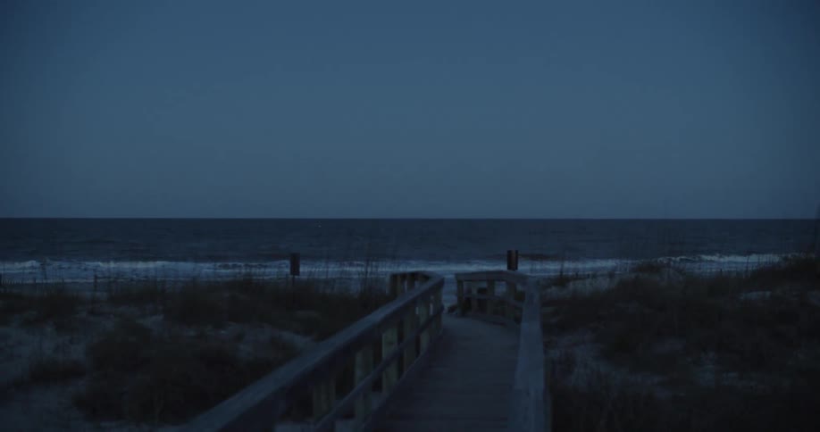 The tide flows onto the beach shore