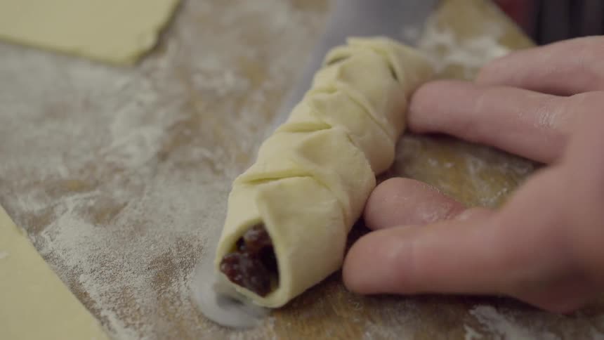 A pastry being picked up with a knife