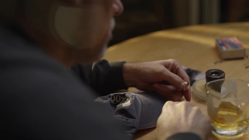 The man places a ring on the table