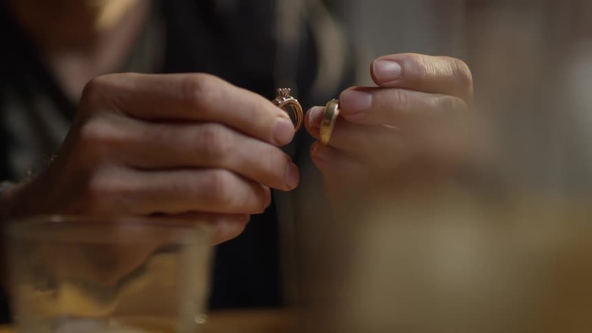 Man holds rings in his hands