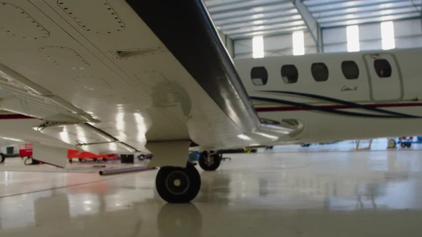 Airplane sits in a hangar