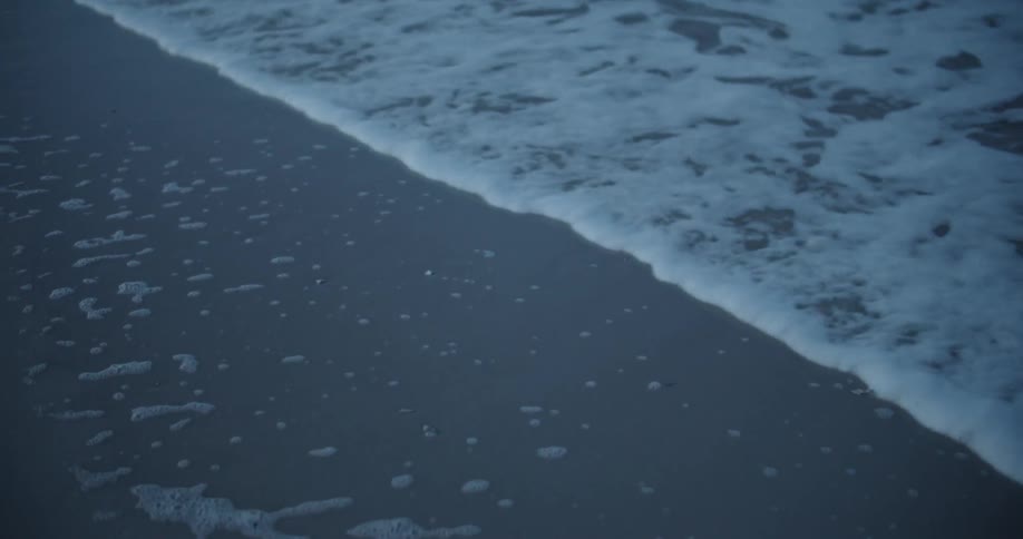 Waves roll into shore at the beach