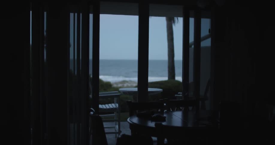 A quiet house with water flowing in a beach outside