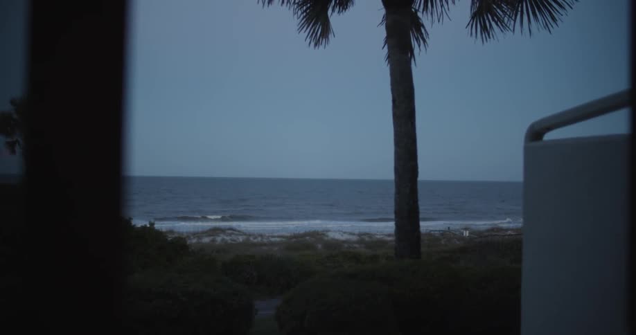 Ocean view as seen from a room nearby on an overcast day