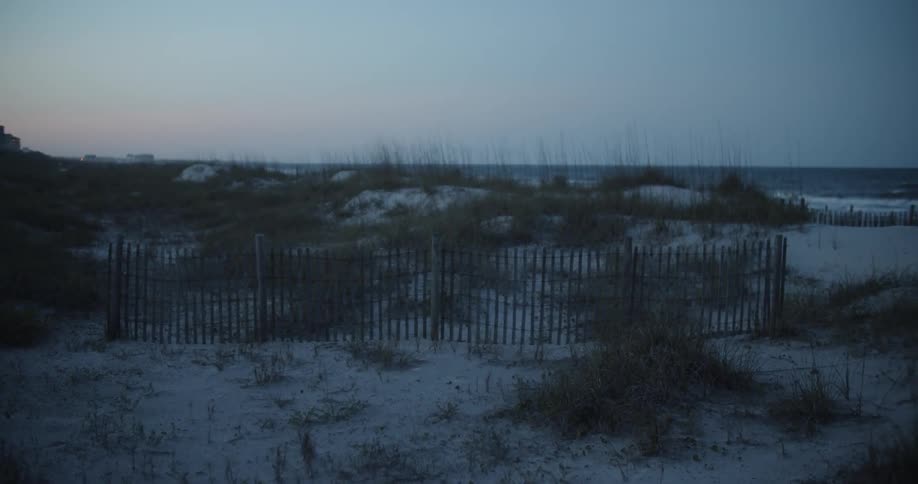 The sun sets over a beach