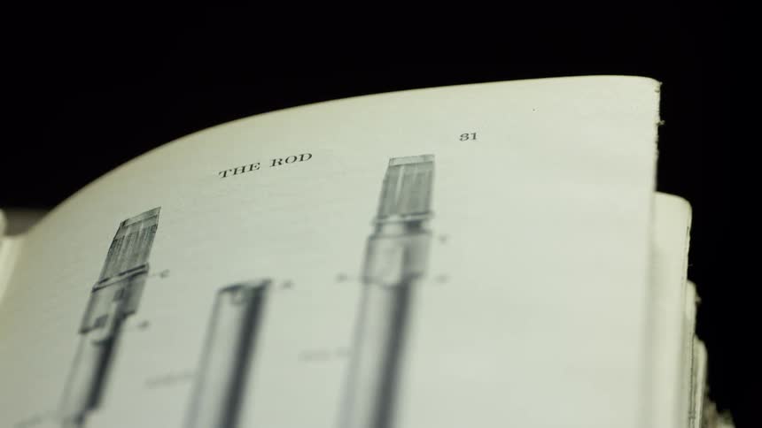A book is lying open and displaying an illustration