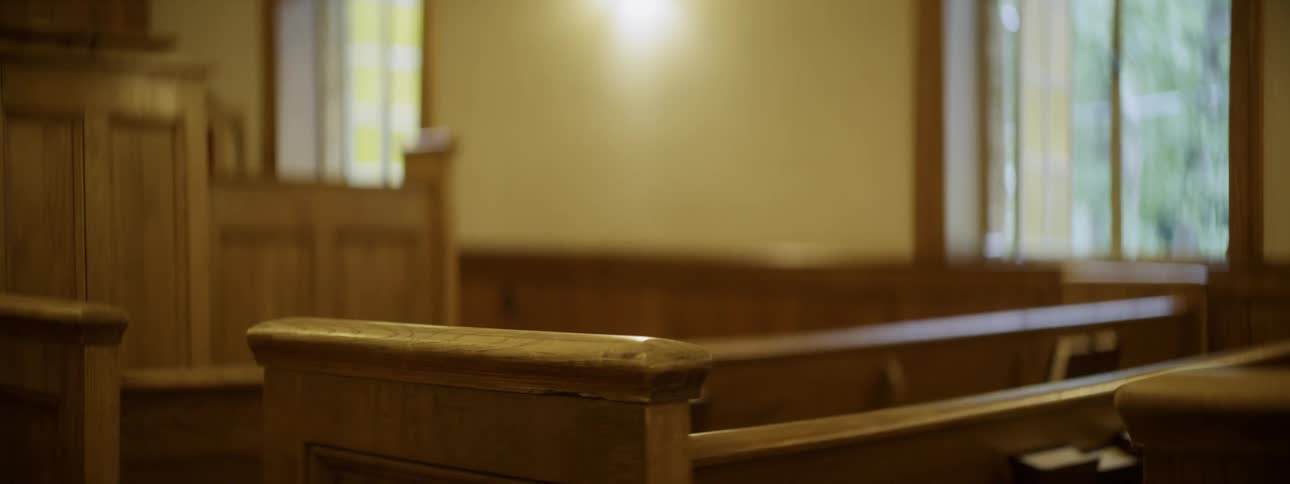 Bench sits empty in a courtroom