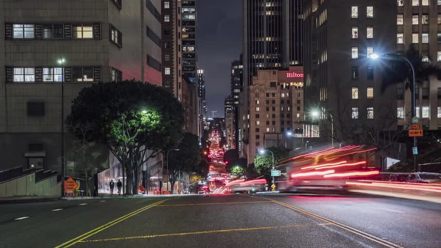 The cars move at dawn through the city