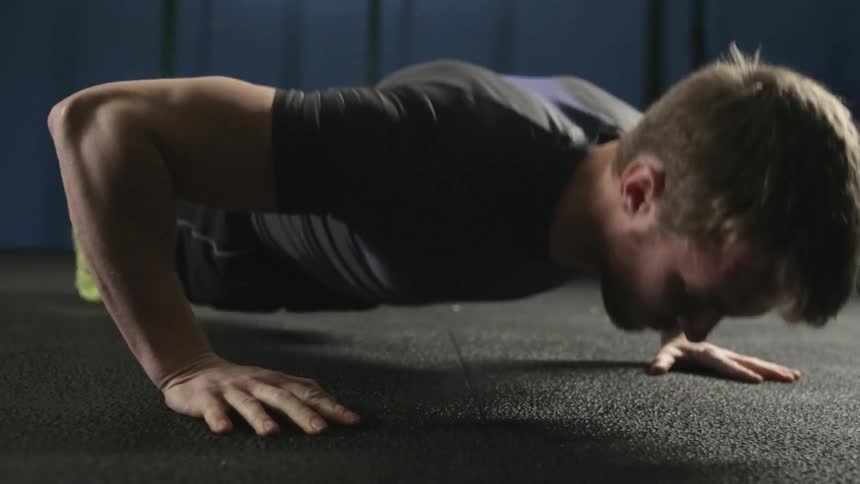 Man doing push ups on the ground