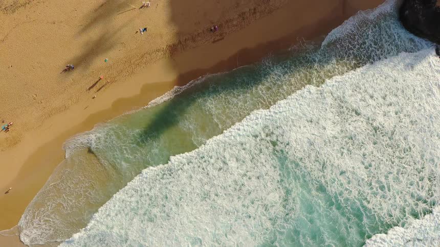 Waves rolling towards a beach