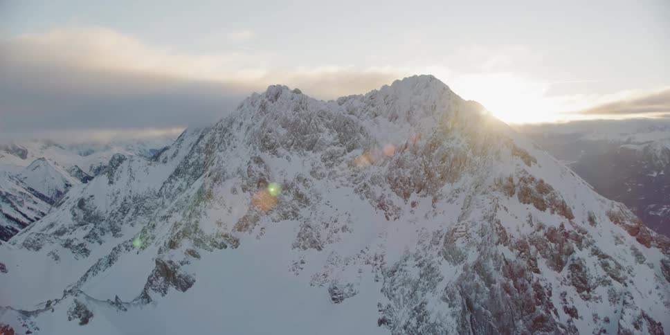 The mountain is white and covered with ice