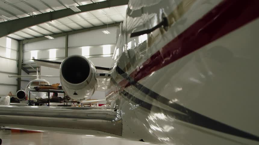 The planes are parked in the hangar