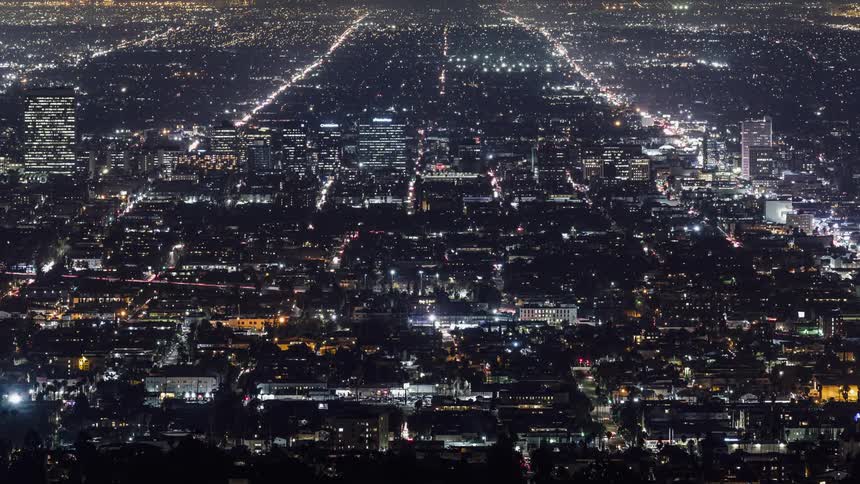 The road is blinking with lights from moving vehicles below