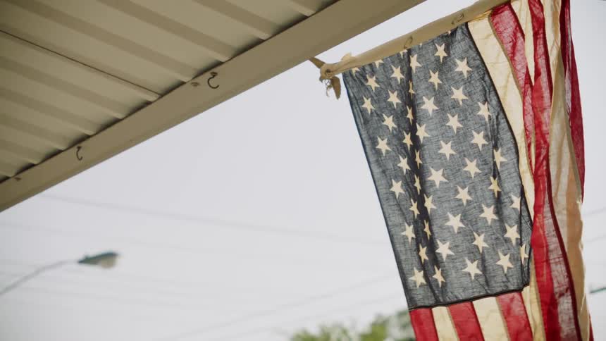 An american flag waves in the breeze